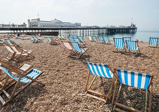 Brighton Beach with Deck Chairs and Pier