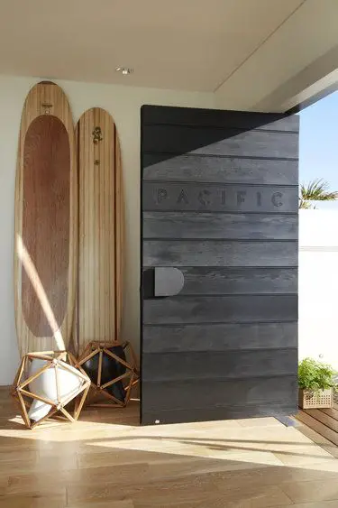wood panels with pacific carved in front door